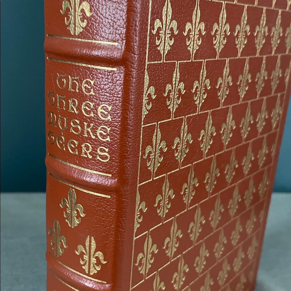 Burnt orange Leather Bound 'The Three Musketeers' Book